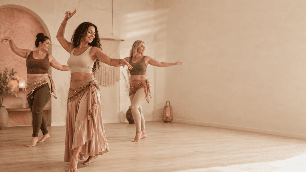 Women in a belly dance class in Pretoria practising intentional, fluid movement.